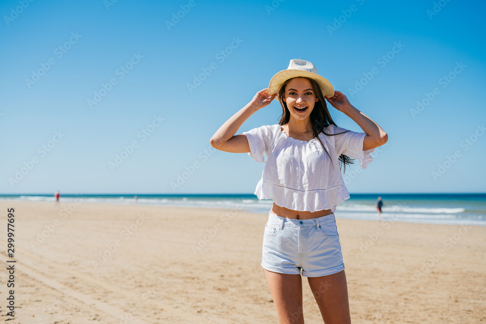 tourist on the beach on the background of the ocean and sand