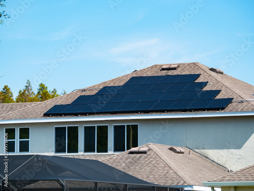 Solar panel on a house roof; Green energy from sun 