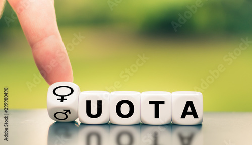 Symbol for women's quota. Hand turns a dice and changes the expression of 