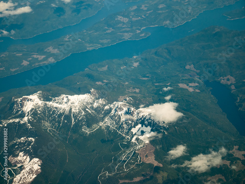 Beautiful Vancouver bay, island and snow mountain seen from airplane photo