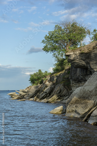 Stone wall on the Baltic sea in the summer. Pakri coast, island in Estonia, Europe.