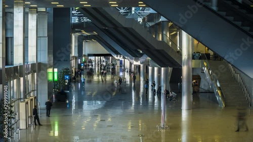 silhouettes of business people in the lobby of the business center,time lapse