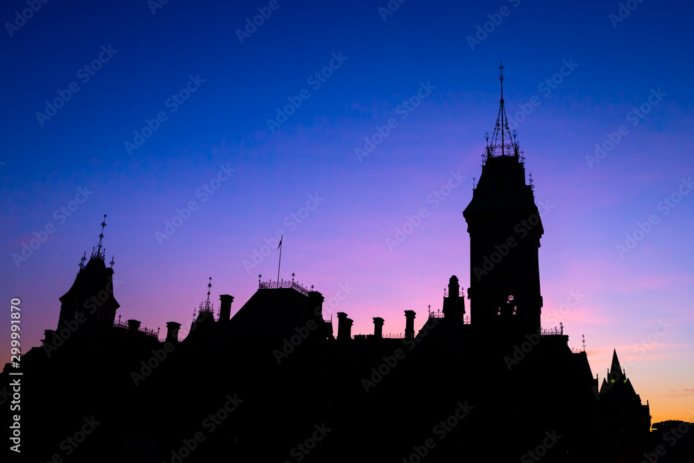 View of Canada parliament building in Ottawa during sunset. This photo is taken from MacKenzie King bridge above Rideau canal. 