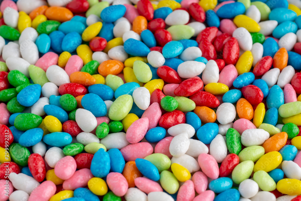 Many candies in multi-colored glaze background Many candies in multi-colored glaze background