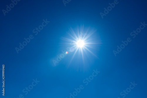 Принти на полотні Sun, sunbeams against blue sky - cloudless heaven