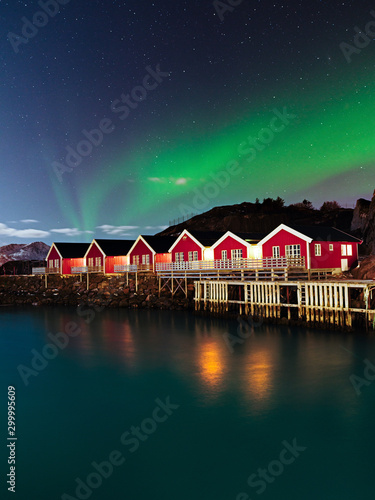 Northern Lights over Fishing Huts in Lofoten Islands