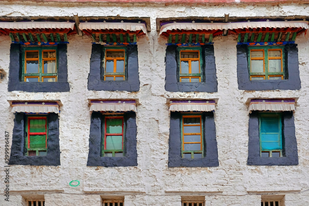 White walls and colorful windows of the Sera Monastery in Lhasa, Tibet.
