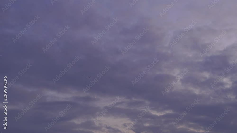 The blue sky has a beautiful white cloud mass with a copy of the space. Birds fly South. The blue sky has a beautiful white cloud mass with a copy of the space. Birds fly South.