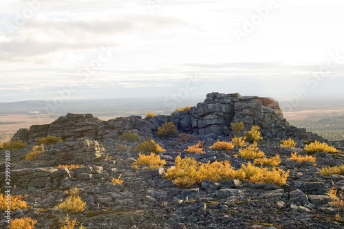 Cliff, mountains, stone wall and forest panoramic view in autumn. Fall colors - ruska time in Pyha-Nattanen. Urho Kekkonen National Park in north Finland. Laplan photo