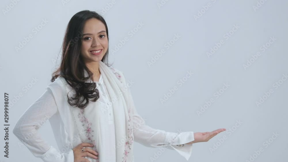 Portrait young beautiful woman in white. presenting copyspace Portrait young beautiful woman in white. presenting copyspace