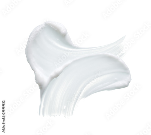White texture and smear of face cream or white acrylic paint isolated on white background photo
