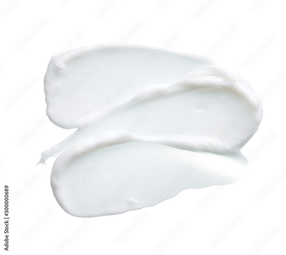 White texture and smear of face cream or white acrylic paint isolated on white background White texture and smear of face cream or white acrylic paint isolated on white background