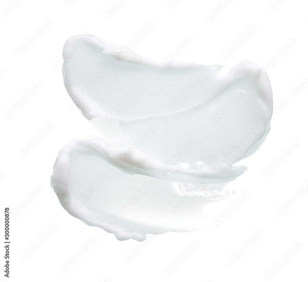 White texture and smear of face cream or white acrylic paint isolated on white background White texture and smear of face cream or white acrylic paint isolated on white background