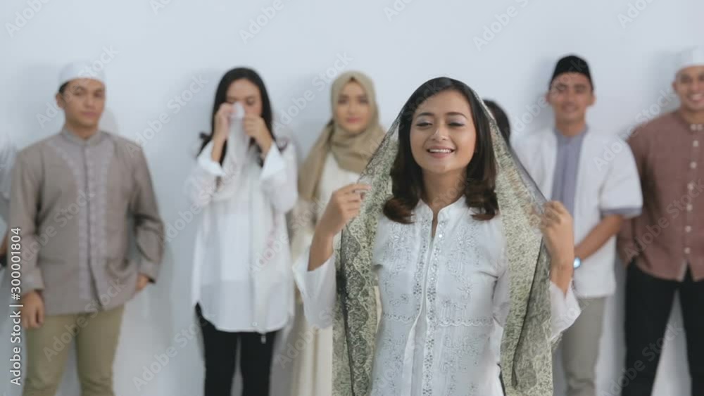 Group of happy muslim friends greeting and smiling. eid mubarak ramadan kareem concept Group of happy muslim friends greeting and smiling. eid mubarak ramadan kareem concept