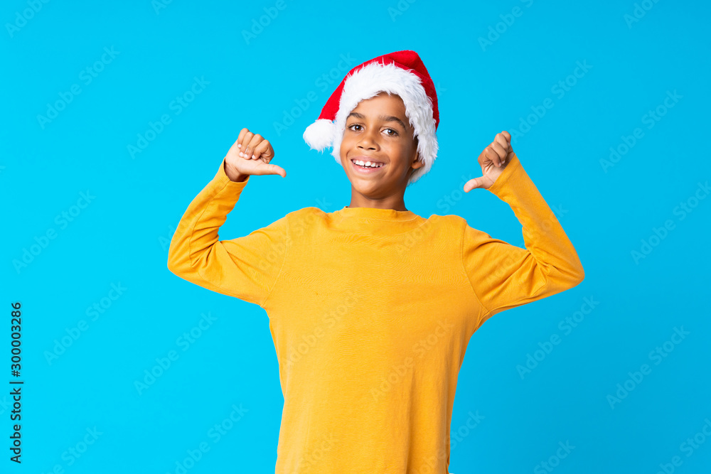 African American boy with christmas hat proud and self-satisfied African American boy with christmas hat proud and self-satisfied