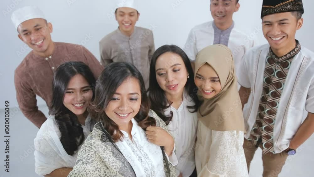 Group of happy muslim friends taking selfie together. eid mubarak ramadan kareem concept Group of happy muslim friends taking selfie together. eid mubarak ramadan kareem concept