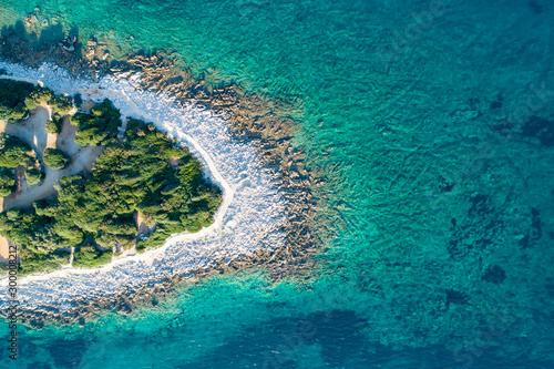 Aerial view of sea and beach in a lagoon on Cres   isola Cherso    Island Croatia  close to Punta Kriza   Punta Croce  . It is a part of national where rocks and sand and forest merge on a coast. 