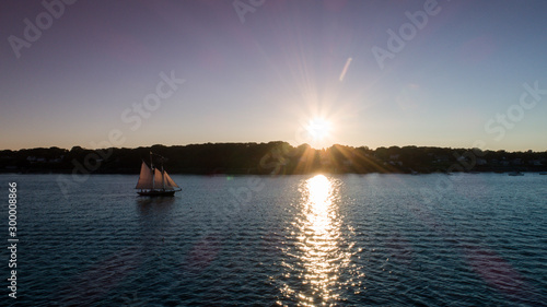 Harpswell Maine USA - Sailing the atlantic at sunset photo