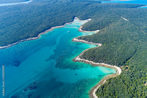 Aerial view of sea and beach in a lagoon on Cres ( isola Cherso ) Island Croatia, close to Punta Kriza ( Punta Croce ). It is a part of national where rocks and sand and forest merge on a coast. 