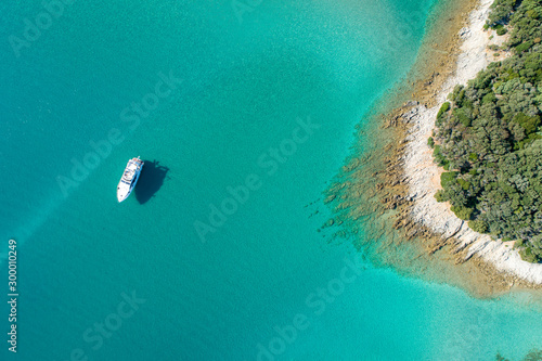 Aerial view of sea and beach in a lagoon on Cres ( isola Cherso )  Island Croatia, close to Punta Kriza ( Punta Croce ). It is a part of national where rocks and sand and forest merge on a coast.  photo