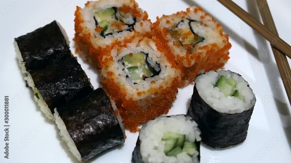 Fresh Sushi On White Plate With Chopsticks Panning Slider Shot.. Fresh Sushi On White Plate With Chopsticks Panning Slider Shot..