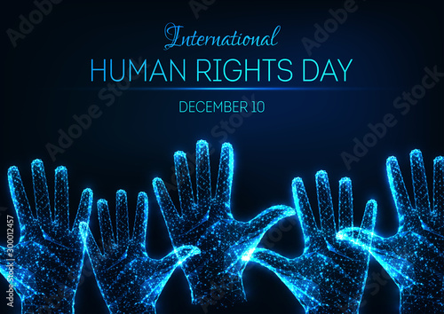 Futuristic glowing low poly International human rights day banner with raised up open hands and text