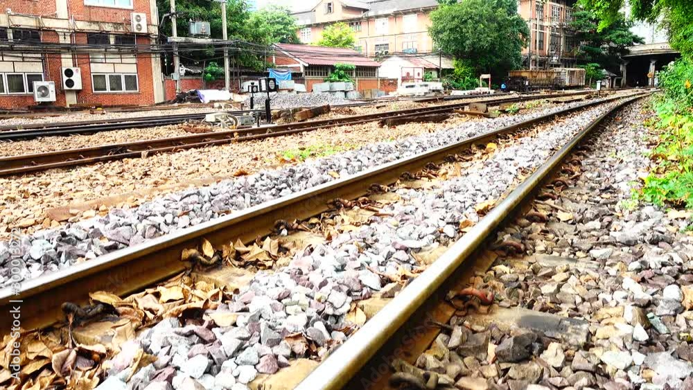4K Train at the station train tracks leading in city transporttation 4K Train at the station train tracks leading in city transporttation