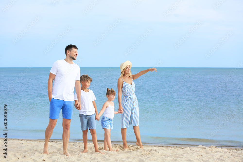 Happy family walking on sea beach Happy family walking on sea beach