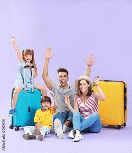 Happy family with luggage o...