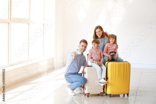 Happy family with luggage t...