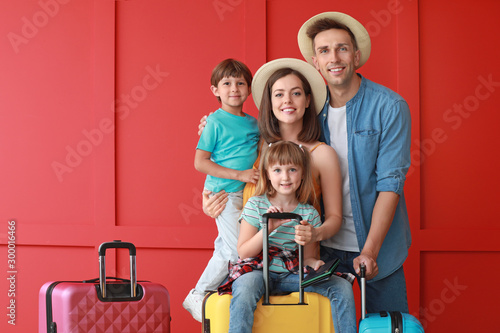 Happy family with luggage o...