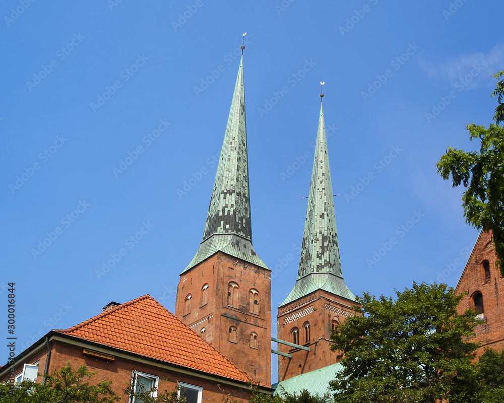 Close-up view of the two towers of the Lübeck Cathedral. Lubeck is the famous tourist destination in Schleswig-Holstein, northern Germany. UNESCO World Heritage