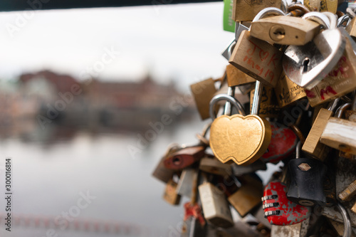 Fototapeta Naklejka Na Ścianę i Meble -  Love locks on a bridge in a rainy stockholm