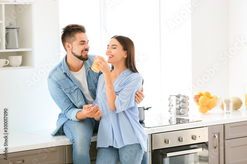 Beautiful young couple drin...