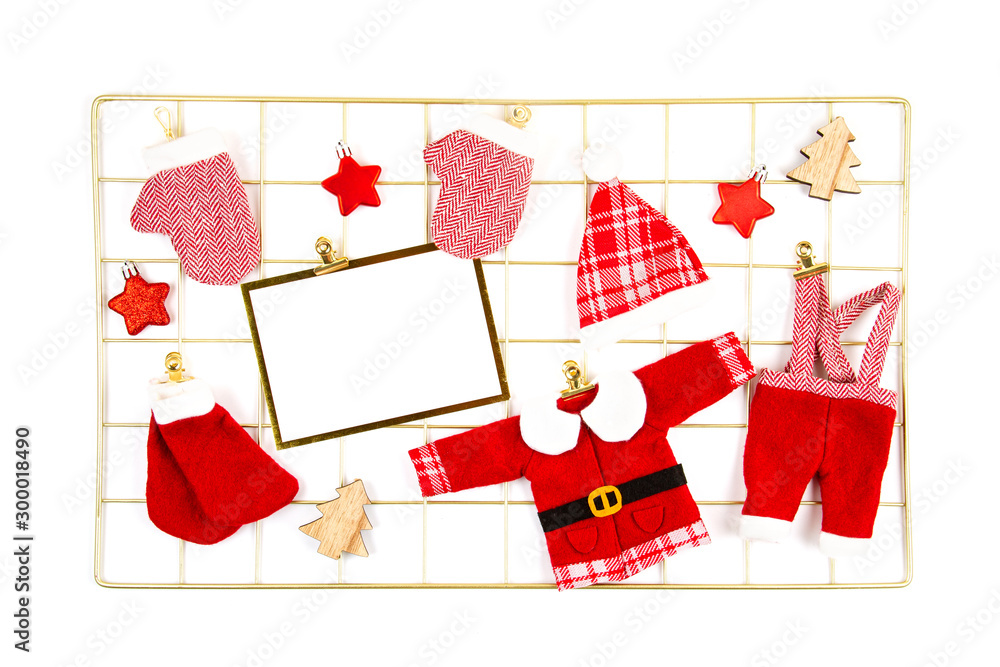 Cute toy Santa clothers over the white background. Cute toy Santa clothers over the white background.