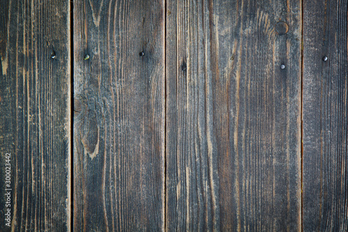 Old brown wood texture background. Wooden boards with nails