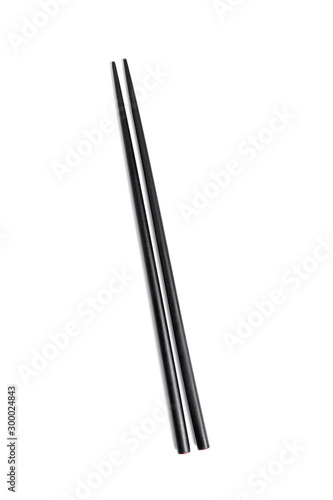 Two Black wooden chopsticks isolated on white background