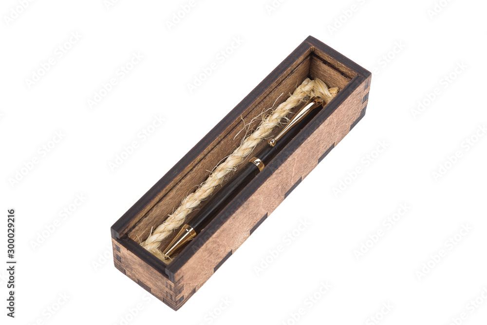 Beautiful wooden box with ballpoint pen inside on a white background. Beautiful wooden box with ballpoint pen inside on a white background.