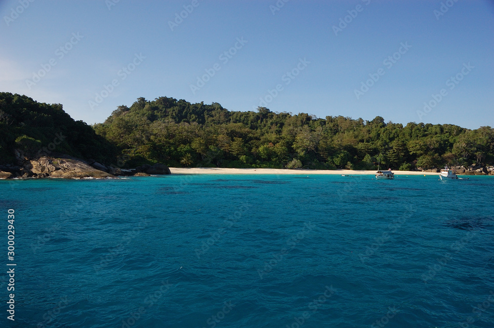 A white strip of sand in a beach of the Similan Islands in Thailand