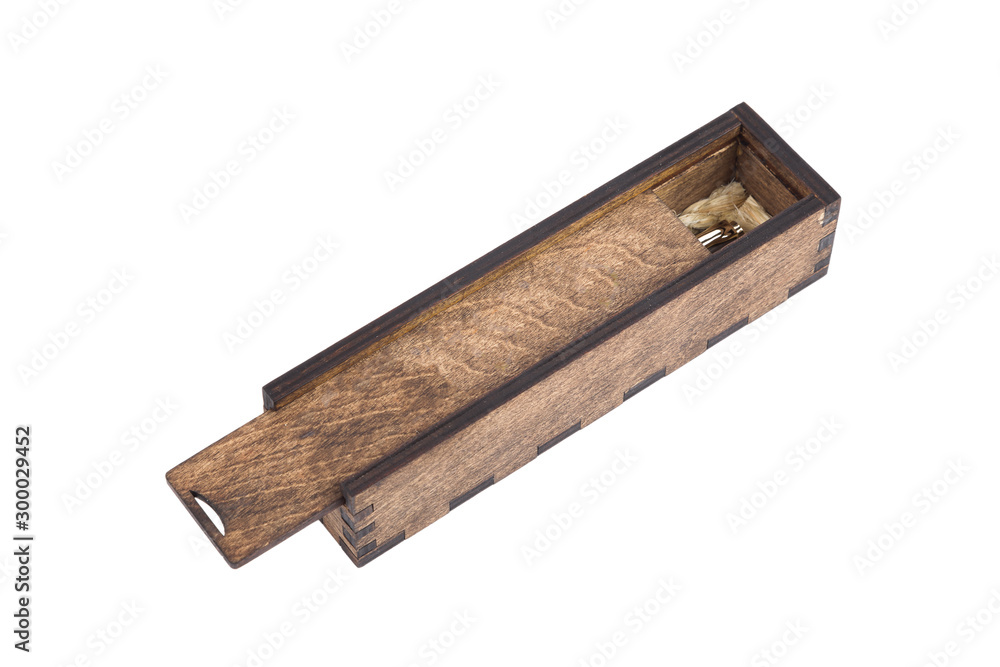 Beautiful wooden box with ballpoint pen inside on a white background. Beautiful wooden box with ballpoint pen inside on a white background.