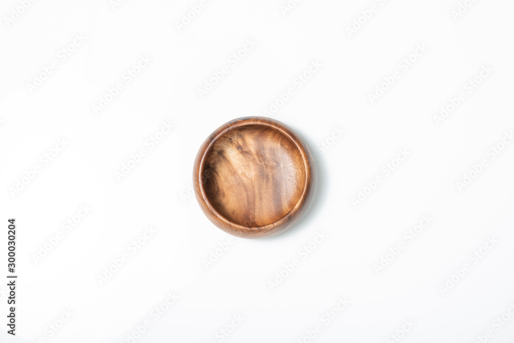 Empty wooden bowl isolated on white, top view. Empty wooden bowl isolated on white, top view.