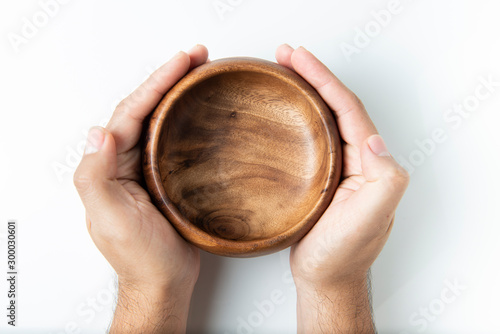 Empty wooden bowl isolated on white, top view.
