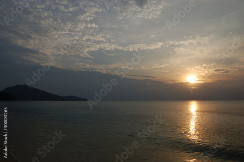 The sun going down at Nai Yang Beach  Phuket  Thailand