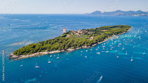 Aerial drone shot view of yachts between Ile Sainte Marguerite and Ile Saint Honorat in mediterranean sea