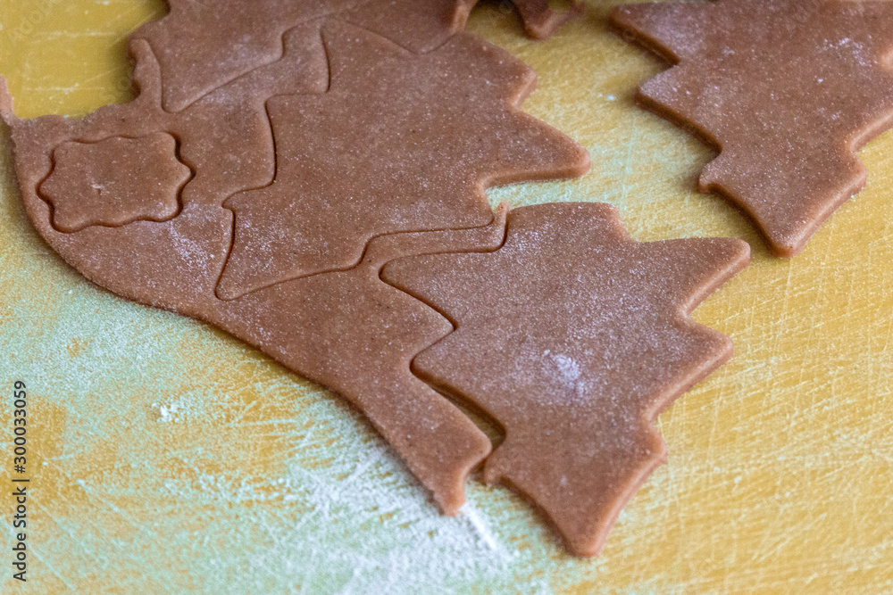 Christmas shaped gingerbread cookie from the raw dough before baking