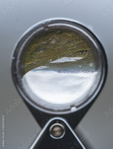 Mountains through a lens - magnifying glass © Ilari