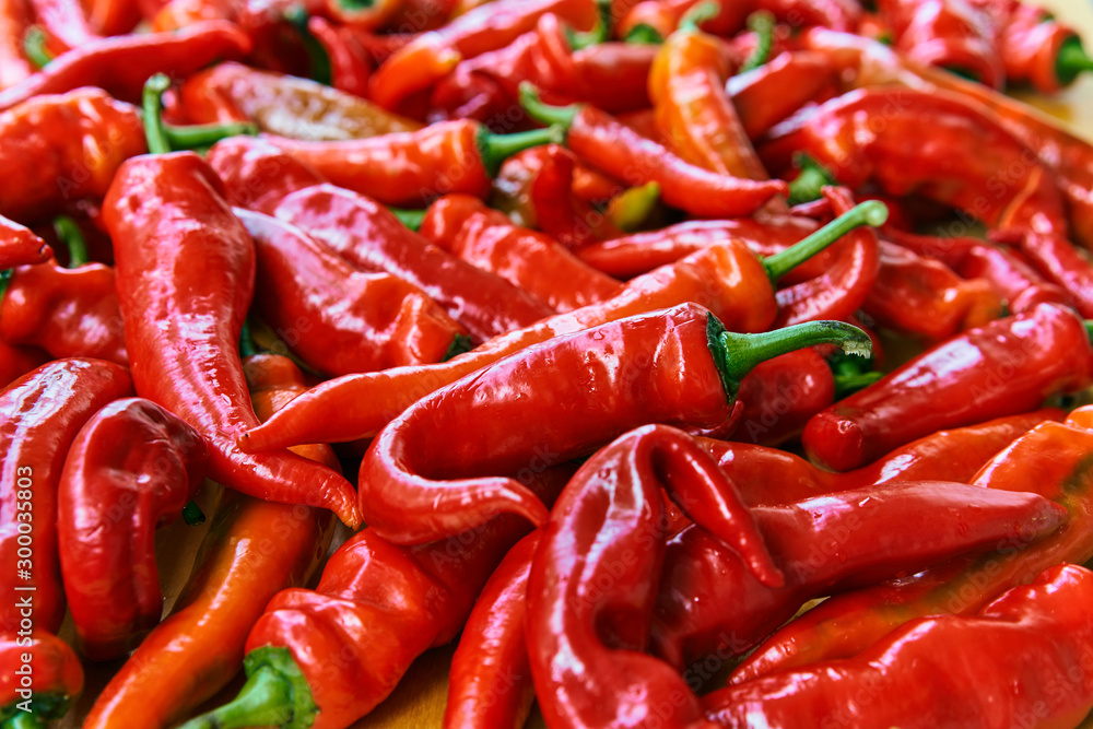 Red hot chilli peppers pattern texture background. Close up. Landscape. A backdrop ofRed hot chilli peppers. Street vegetable market. Group of Red hot chilli peppers Red hot chilli peppers pattern texture background. Close up. Landscape. A backdrop ofRed hot chilli peppers. Street vegetable market. Group of Red hot chilli peppers