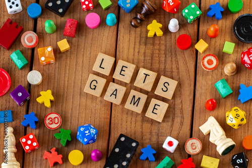 Konstfotografi "Lets Game" spelled out in wooden letter tiles