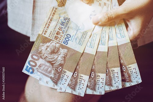 Hand female counting five hundred hong kong banknotes,Close up photo