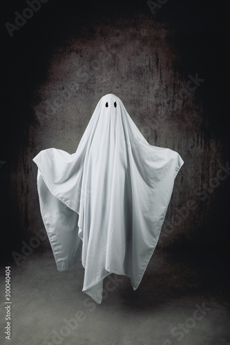 Ghost in a sheet floating in the air photo